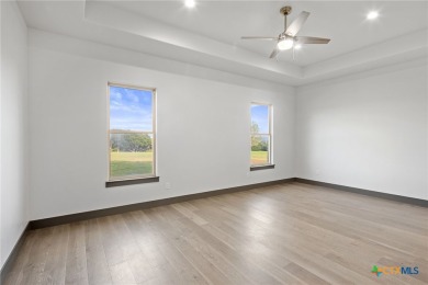 Experience refined living in this beautifully built 2022 home on Apple Rock Golf Course - Horseshoe Bay in Texas - for sale on GolfHomes.com, golf home, golf lot