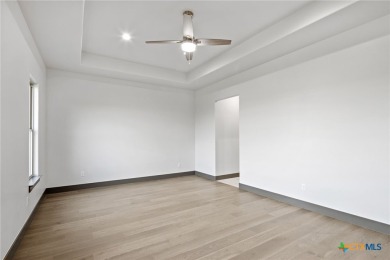 Experience refined living in this beautifully built 2022 home on Apple Rock Golf Course - Horseshoe Bay in Texas - for sale on GolfHomes.com, golf home, golf lot