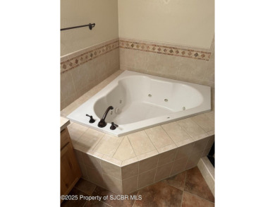 Quality home on the 11th fairway featuring 12 foot ceilings, gas on San Juan Country Club in New Mexico - for sale on GolfHomes.com, golf home, golf lot