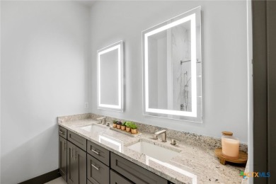 Experience refined living in this beautifully built 2022 home on Apple Rock Golf Course - Horseshoe Bay in Texas - for sale on GolfHomes.com, golf home, golf lot