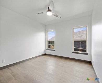 Experience refined living in this beautifully built 2022 home on Apple Rock Golf Course - Horseshoe Bay in Texas - for sale on GolfHomes.com, golf home, golf lot
