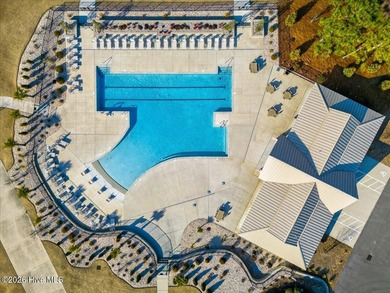 Located in the gated community of Compass Pointe in Leland, this on Compass Pointe Golf Course in North Carolina - for sale on GolfHomes.com, golf home, golf lot