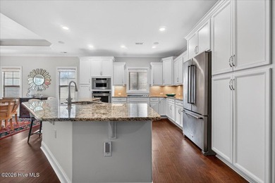 Located in the gated community of Compass Pointe in Leland, this on Compass Pointe Golf Course in North Carolina - for sale on GolfHomes.com, golf home, golf lot