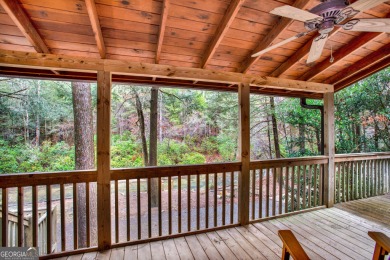 Nature abounds at this furnished cabin nestled on the banks of on White Path Golf Club in Georgia - for sale on GolfHomes.com, golf home, golf lot