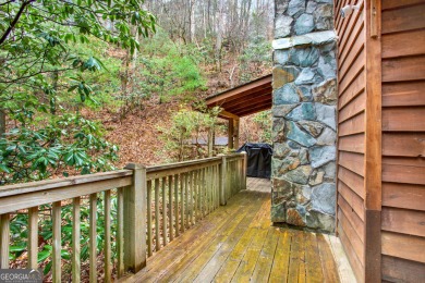 Nature abounds at this furnished cabin nestled on the banks of on White Path Golf Club in Georgia - for sale on GolfHomes.com, golf home, golf lot