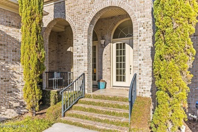 Some homes capture water views. This one lives in them. Custom on Ocean Ridge Plantation in North Carolina - for sale on GolfHomes.com, golf home, golf lot