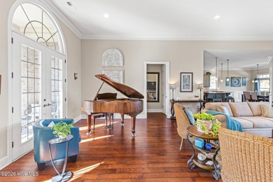 Some homes capture water views. This one lives in them. Custom on Ocean Ridge Plantation in North Carolina - for sale on GolfHomes.com, golf home, golf lot