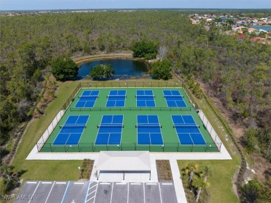 This coastal contemporary home with private preserve view will on Herons Glen Golf and Country Club in Florida - for sale on GolfHomes.com, golf home, golf lot