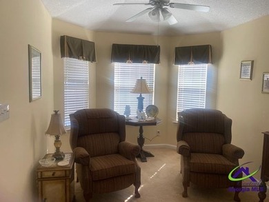 Enjoy the lovely view of the golf course from the screened-in on Houston Springs Resort and Golf Course in Georgia - for sale on GolfHomes.com, golf home, golf lot