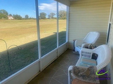 Enjoy the lovely view of the golf course from the screened-in on Houston Springs Resort and Golf Course in Georgia - for sale on GolfHomes.com, golf home, golf lot