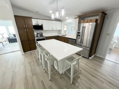 Beautifully renovated 2bd/2ba stucco home. Open concept layout on Del Tura Golf and Country Club in Florida - for sale on GolfHomes.com, golf home, golf lot