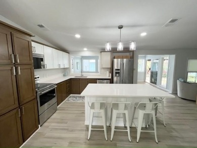 Beautifully renovated 2bd/2ba stucco home. Open concept layout on Del Tura Golf and Country Club in Florida - for sale on GolfHomes.com, golf home, golf lot