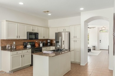 Welcome to this meticulously maintained 3-bedroom, 2-bathroom + on Estrella Mountain Ranch Golf Course in Arizona - for sale on GolfHomes.com, golf home, golf lot