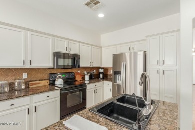 Welcome to this meticulously maintained 3-bedroom, 2-bathroom + on Estrella Mountain Ranch Golf Course in Arizona - for sale on GolfHomes.com, golf home, golf lot