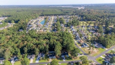 Nestled in the highly sought after Colonial Charters Golf Course on Palmetto Greens Golf and Country Club in South Carolina - for sale on GolfHomes.com, golf home, golf lot