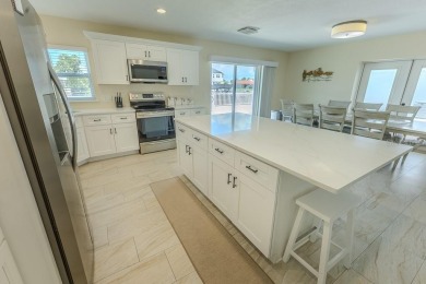 Coastal luxury meets resort-style living in this updated 3,000 on Gulf Harbors Golf Course in Florida - for sale on GolfHomes.com, golf home, golf lot