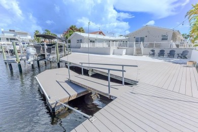 Coastal luxury meets resort-style living in this updated 3,000 on Gulf Harbors Golf Course in Florida - for sale on GolfHomes.com, golf home, golf lot