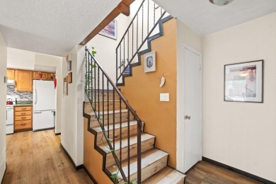 Welcome to your bright, 2-story, end-unit townhome in the Villa on Arroyo Del Oso Golf Course in New Mexico - for sale on GolfHomes.com, golf home, golf lot