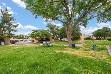 Welcome to your bright, 2-story, end-unit townhome in the Villa on Arroyo Del Oso Golf Course in New Mexico - for sale on GolfHomes.com, golf home, golf lot