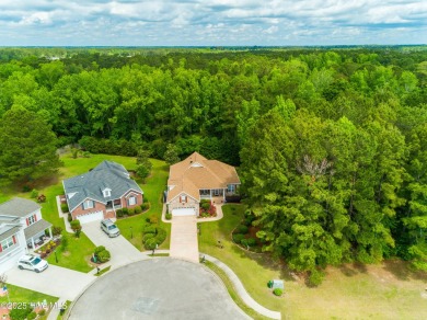 Tucked away on a quiet cul-de-sac in a prestigious gated golf on Brunswick Plantation and Golf Resorts in North Carolina - for sale on GolfHomes.com, golf home, golf lot