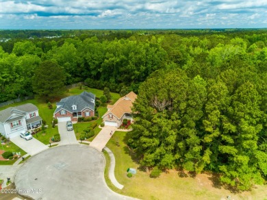 Tucked away on a quiet cul-de-sac in a prestigious gated golf on Brunswick Plantation and Golf Resorts in North Carolina - for sale on GolfHomes.com, golf home, golf lot