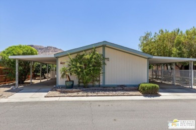 Dramatic mountain views enhance this open and light home behind on Date Palm Country Club in California - for sale on GolfHomes.com, golf home, golf lot