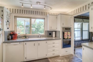 The wet bar features elegant finishes and modern fixtures that on Lake Oroville Golf and Event Center in California - for sale on GolfHomes.com, golf home, golf lot