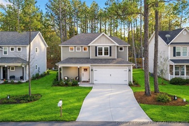 Welcome home to this well-maintained 4-bedroom, 2.5-bath on Woodlake Country Club in North Carolina - for sale on GolfHomes.com, golf home, golf lot
