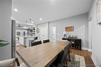 Welcome home to this well-maintained 4-bedroom, 2.5-bath on Woodlake Country Club in North Carolina - for sale on GolfHomes.com, golf home, golf lot