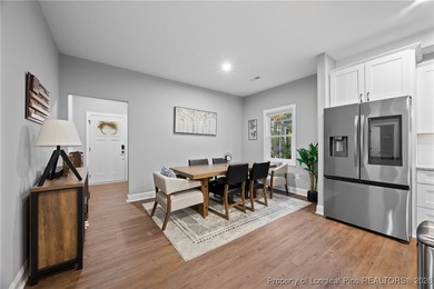 Welcome home to this well-maintained 4-bedroom, 2.5-bath on Woodlake Country Club in North Carolina - for sale on GolfHomes.com, golf home, golf lot