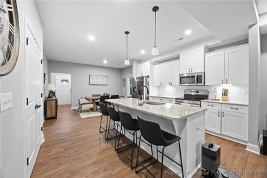 Welcome home to this well-maintained 4-bedroom, 2.5-bath on Woodlake Country Club in North Carolina - for sale on GolfHomes.com, golf home, golf lot