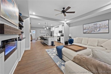 Welcome home to this well-maintained 4-bedroom, 2.5-bath on Woodlake Country Club in North Carolina - for sale on GolfHomes.com, golf home, golf lot