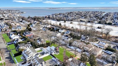 Set on a rare double lot in the Nassau Shores section of East on Peninsula Golf Club in New York - for sale on GolfHomes.com, golf home, golf lot