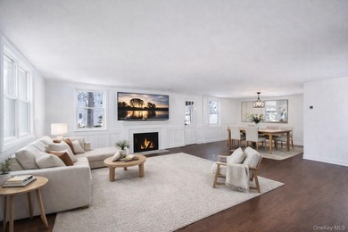 Set on a rare double lot in the Nassau Shores section of East on Peninsula Golf Club in New York - for sale on GolfHomes.com, golf home, golf lot