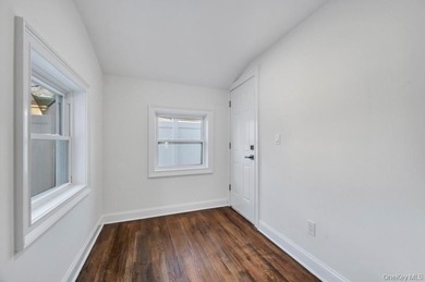 Set on a rare double lot in the Nassau Shores section of on Peninsula Golf Club in New York - for sale on GolfHomes.com, golf home, golf lot