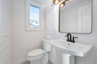 Set on a rare double lot in the Nassau Shores section of on Peninsula Golf Club in New York - for sale on GolfHomes.com, golf home, golf lot