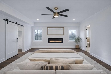 Set on a rare double lot in the Nassau Shores section of on Peninsula Golf Club in New York - for sale on GolfHomes.com, golf home, golf lot