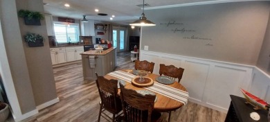 Come settle down and relax in a beautiful, manufactured home on Fairways Country Club in Florida - for sale on GolfHomes.com, golf home, golf lot