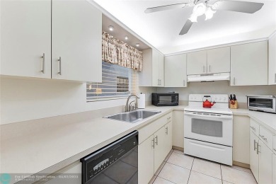 Lovely light and bright first floor corner unit overlooking the on Deer Creek Golf Club in Florida - for sale on GolfHomes.com, golf home, golf lot