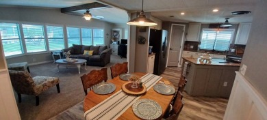 Come settle down and relax in a beautiful, manufactured home on Fairways Country Club in Florida - for sale on GolfHomes.com, golf home, golf lot
