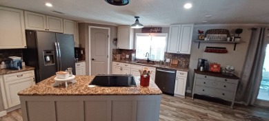Come settle down and relax in a beautiful, manufactured home on Fairways Country Club in Florida - for sale on GolfHomes.com, golf home, golf lot