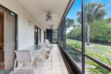Lovely light and bright first floor corner unit overlooking the on Deer Creek Golf Club in Florida - for sale on GolfHomes.com, golf home, golf lot