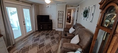 Come settle down and relax in a beautiful, manufactured home on Fairways Country Club in Florida - for sale on GolfHomes.com, golf home, golf lot
