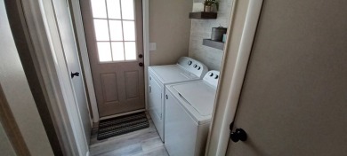 Come settle down and relax in a beautiful, manufactured home on Fairways Country Club in Florida - for sale on GolfHomes.com, golf home, golf lot