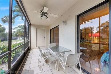 Lovely light and bright first floor corner unit overlooking the on Deer Creek Golf Club in Florida - for sale on GolfHomes.com, golf home, golf lot