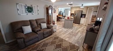 Come settle down and relax in a beautiful, manufactured home on Fairways Country Club in Florida - for sale on GolfHomes.com, golf home, golf lot