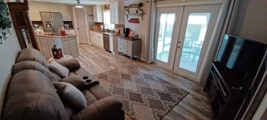 Come settle down and relax in a beautiful, manufactured home on Fairways Country Club in Florida - for sale on GolfHomes.com, golf home, golf lot