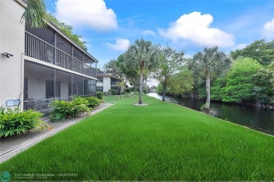 Lovely light and bright first floor corner unit overlooking the on Deer Creek Golf Club in Florida - for sale on GolfHomes.com, golf home, golf lot