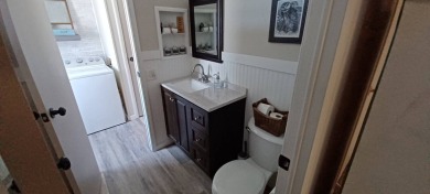 Come settle down and relax in a beautiful, manufactured home on Fairways Country Club in Florida - for sale on GolfHomes.com, golf home, golf lot