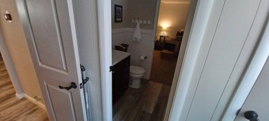 Come settle down and relax in a beautiful, manufactured home on Fairways Country Club in Florida - for sale on GolfHomes.com, golf home, golf lot